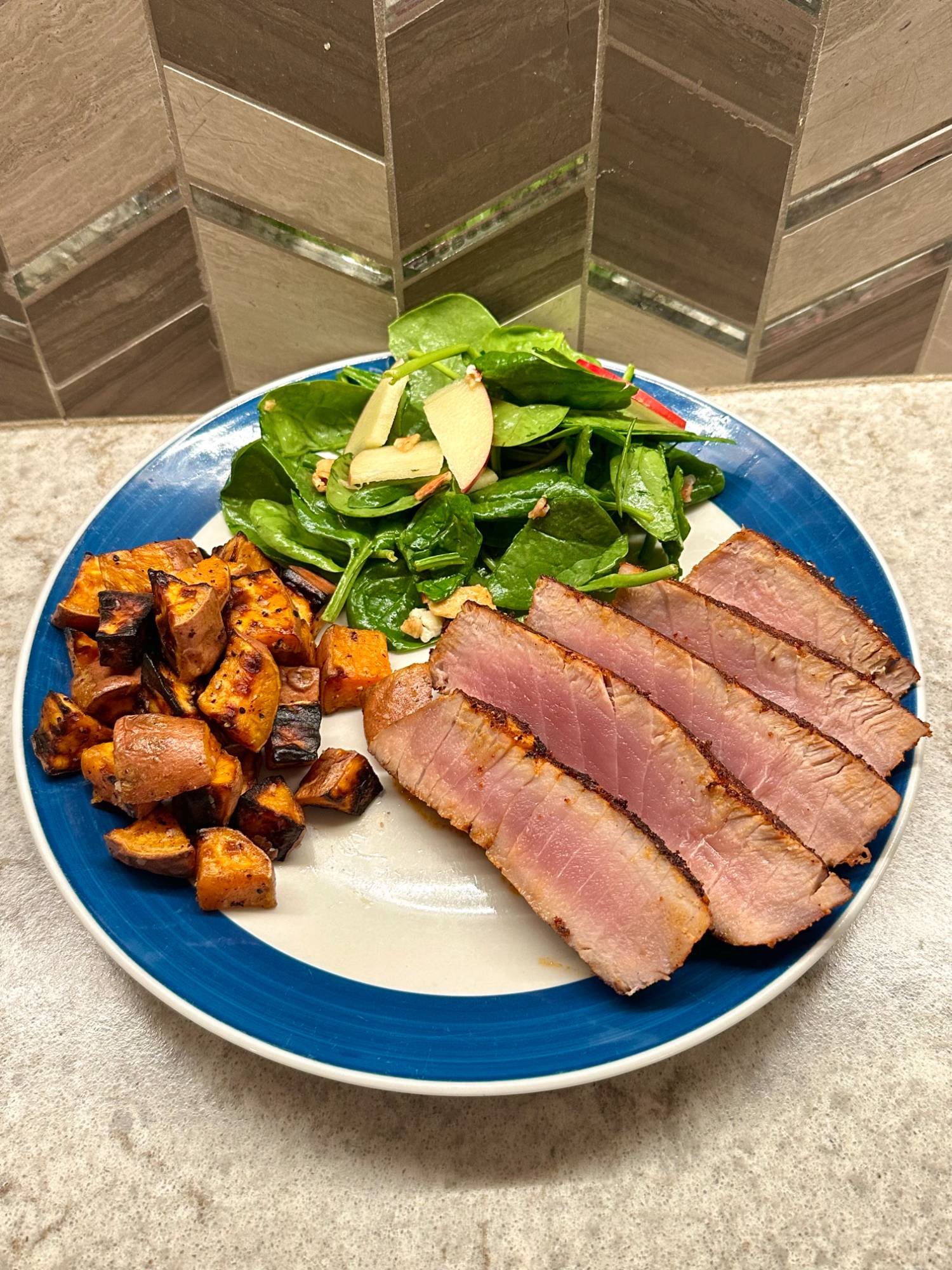 Seared tuna with roasted sweet potato and spinach salad
